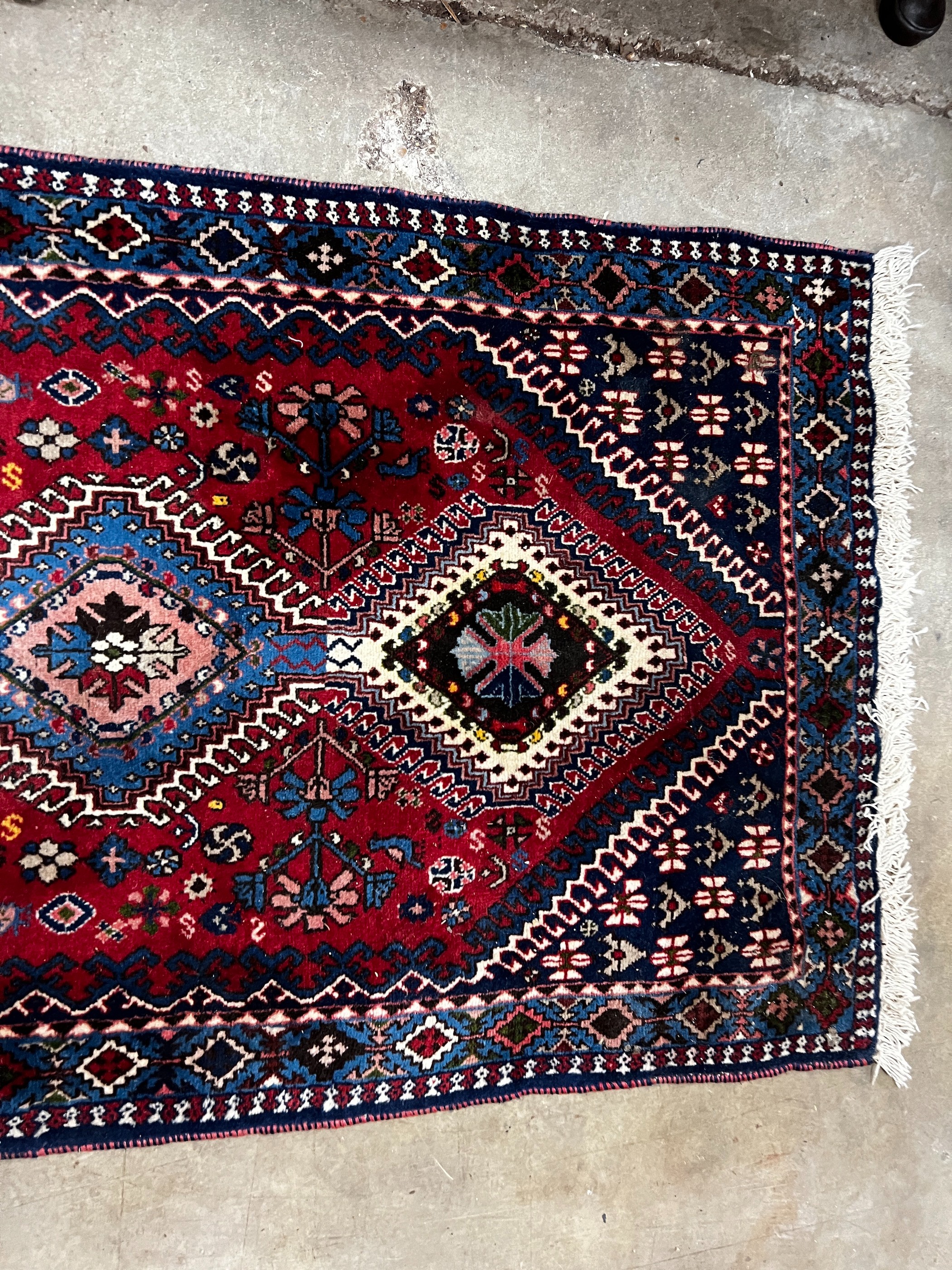 A Caucasian style red ground runner 200cm x 76cm